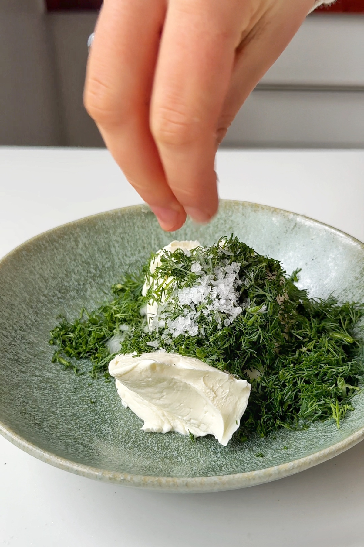 Making cream cheese and dill spread.