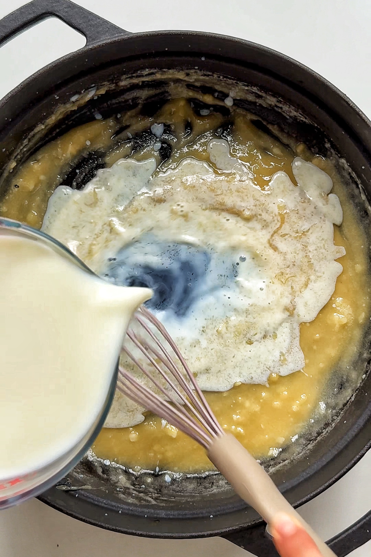 Making a bรฉchamel-style sauce for our Mac and cheese.