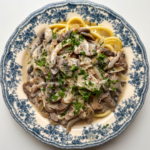 vegan mushroom stroganoff on a blue and white plate.