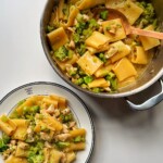 Chicken pasta alfredo with broccoli in a pan and bowl.
