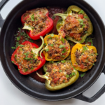 Baked ground turkey stuffed peppers in cast iron pan.