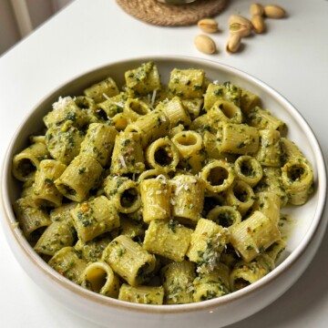 Pistachio pesto in a white bowl.