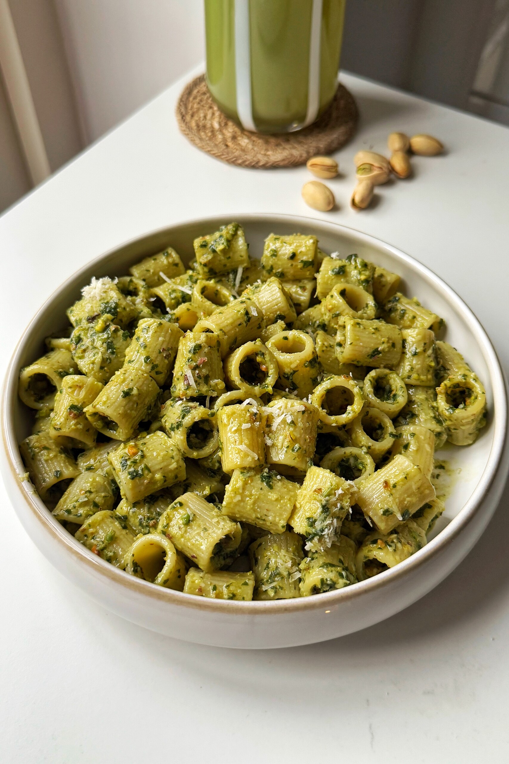 Pistachio pesto in a white bowl.