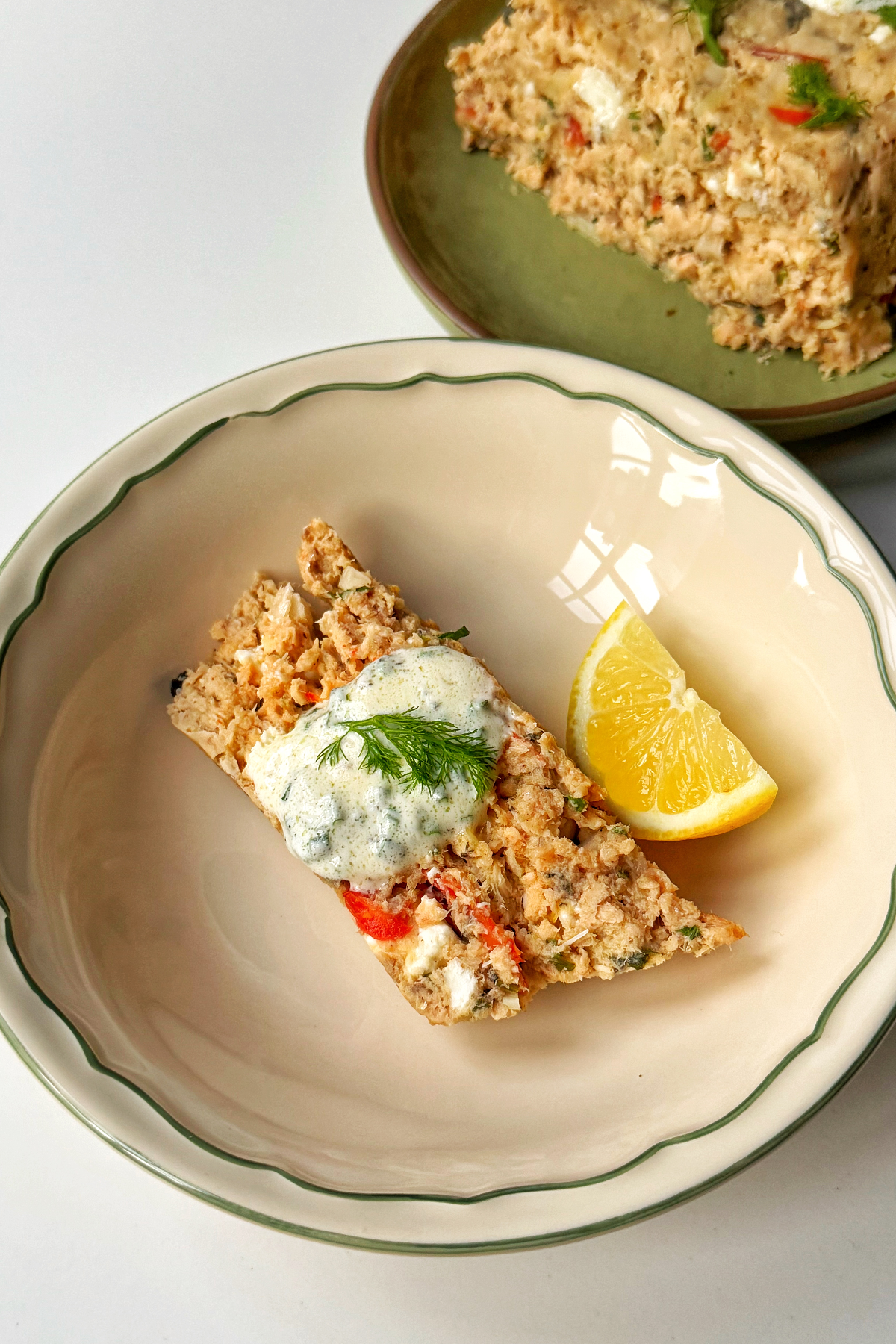 Slice of salmon loaf in a bowl.