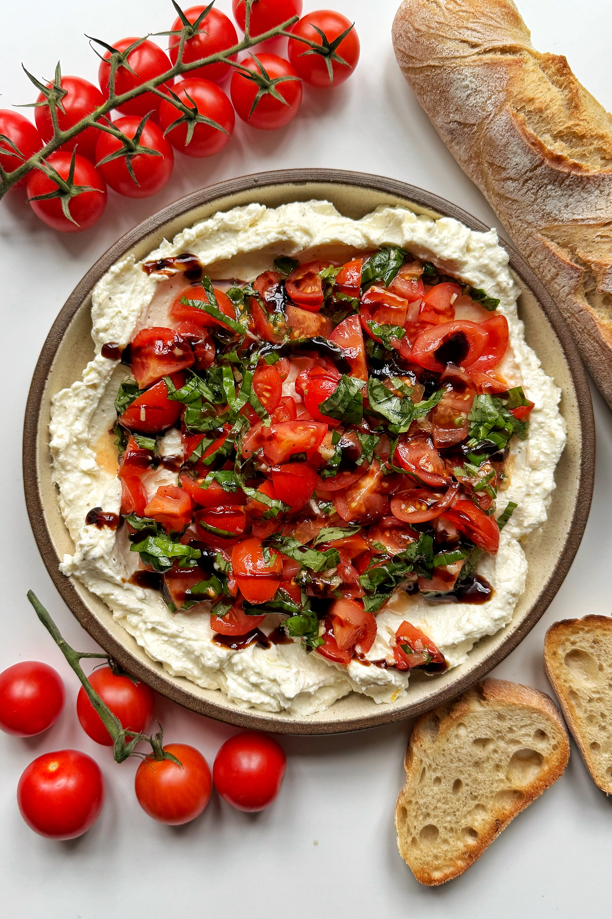 Bruschetta dip with tomatoes and baguette.