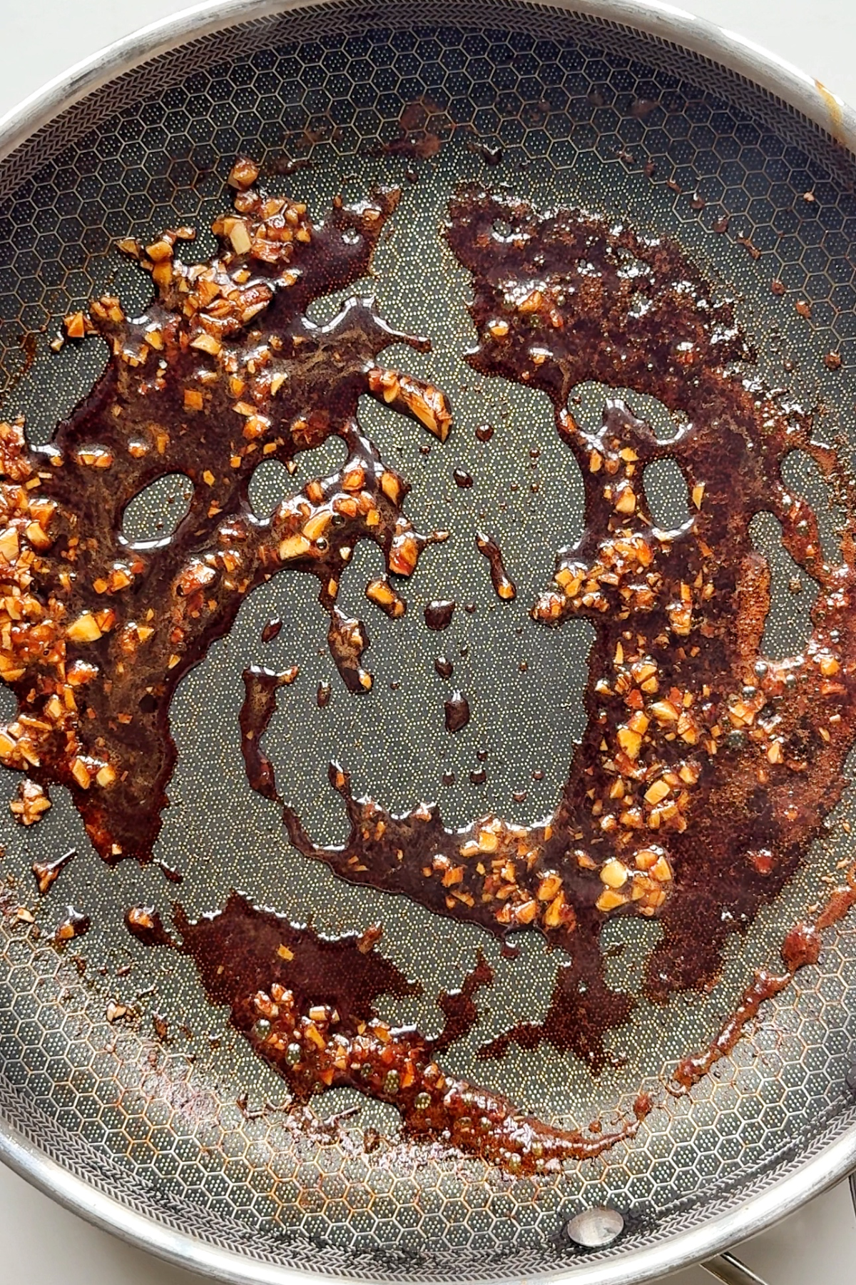 Cooking the Butadon sauce in a pan.