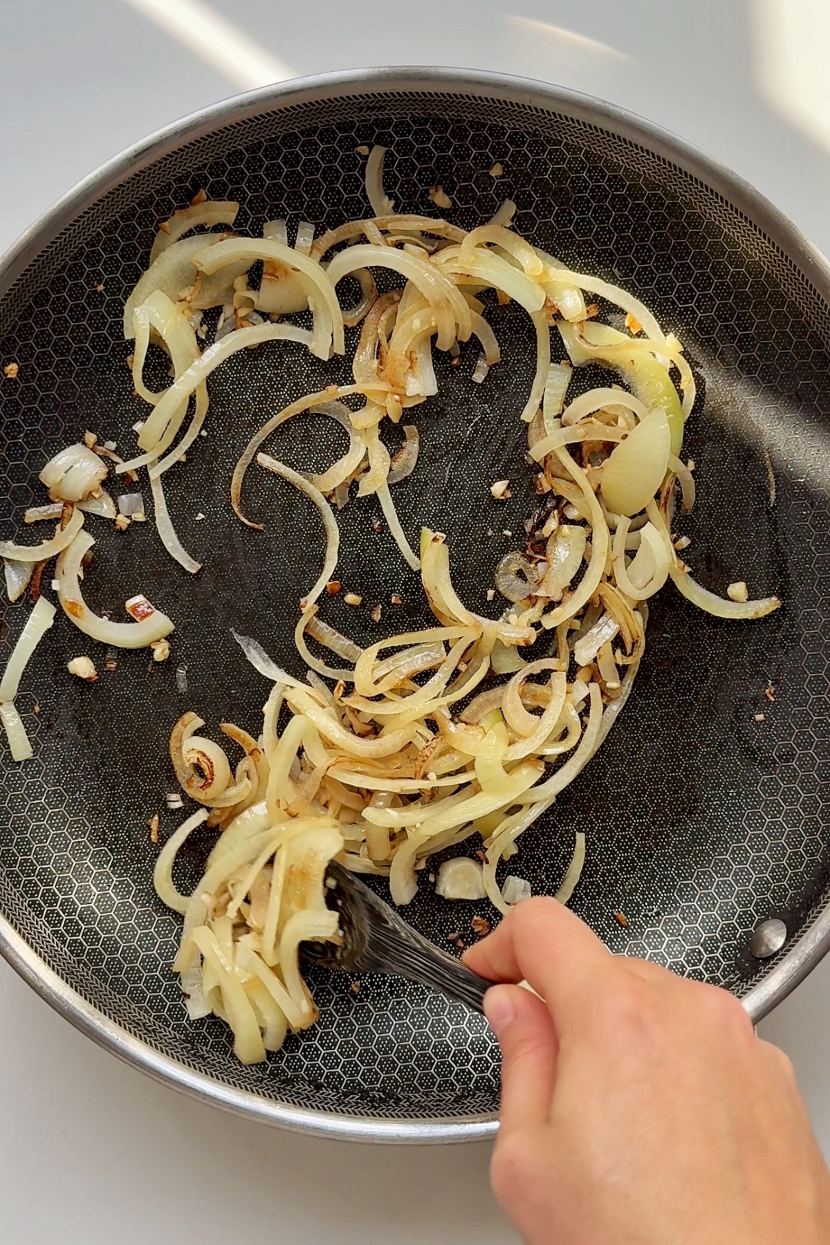 Fry off onions and garlic in a pan.