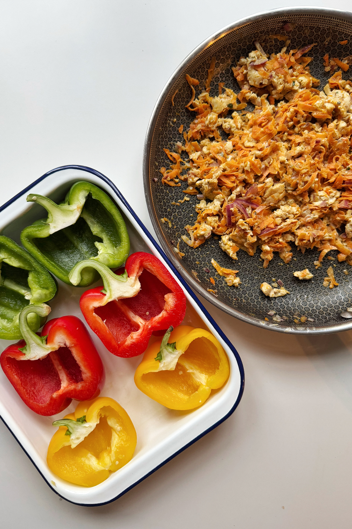 Empty red peppers and the cooked ground chicken mix.