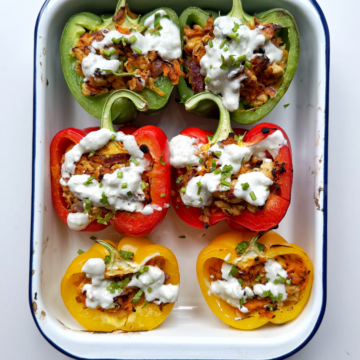 ground chicken stuffed peppers in a baking tin.