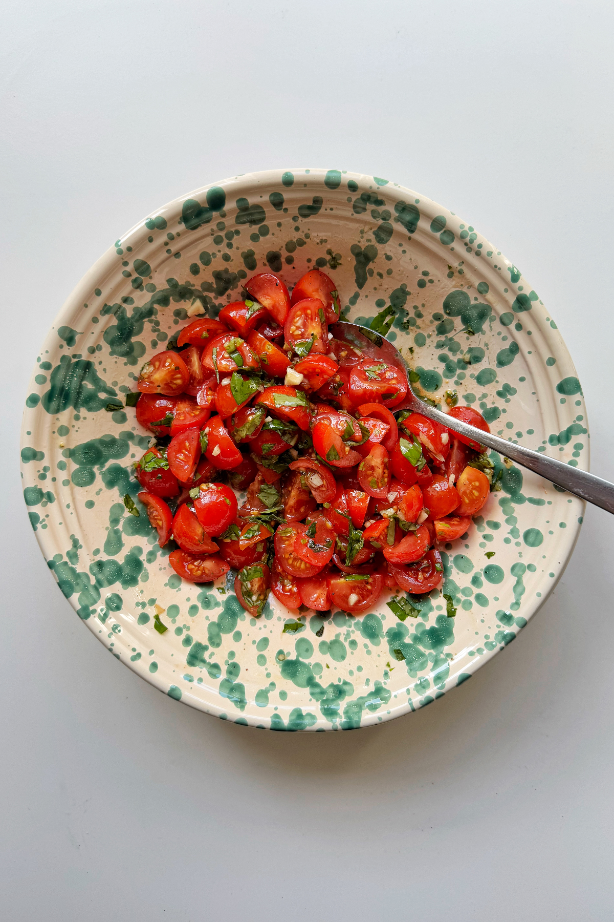Making the tomato basil topping.