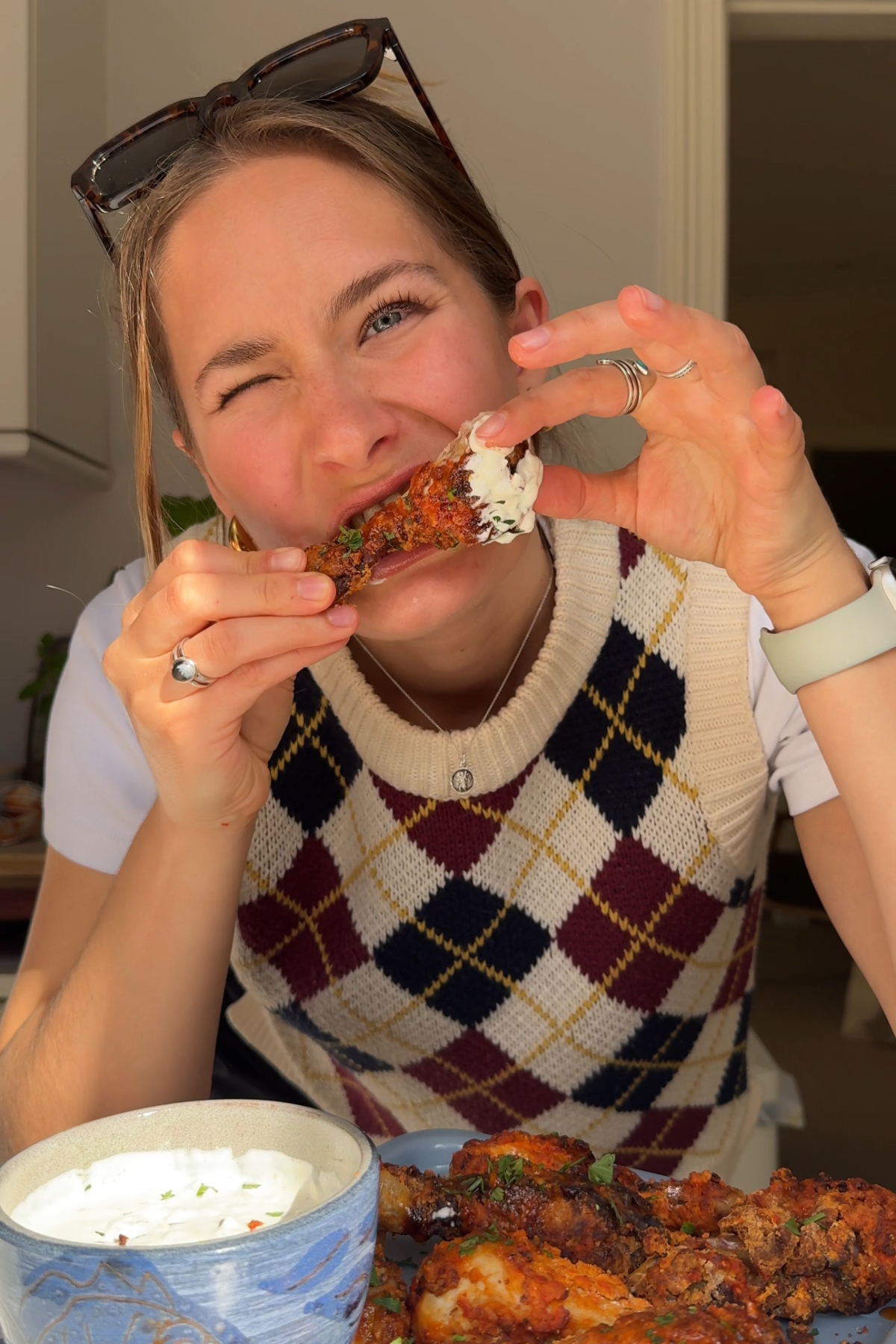 Emily eating air fryer chicken drumsticks