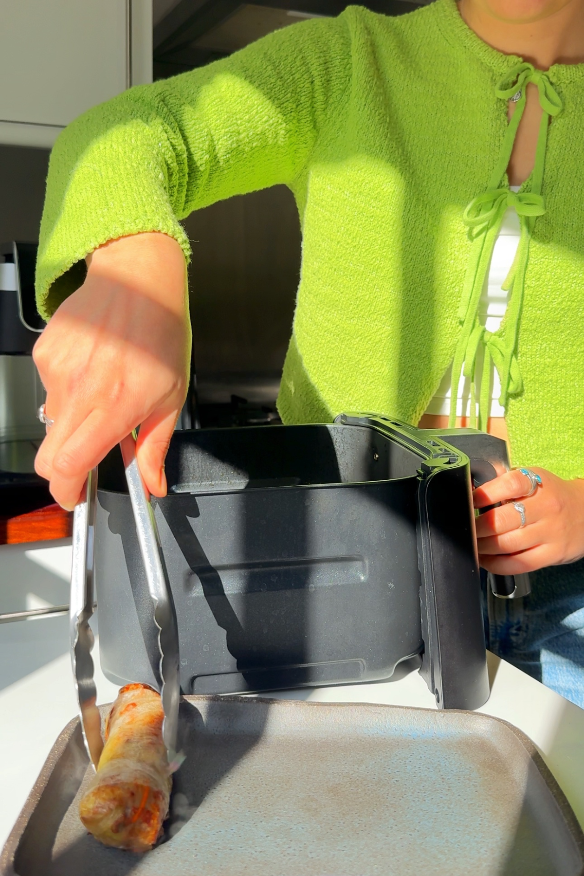 Air frying rice paper rolls.