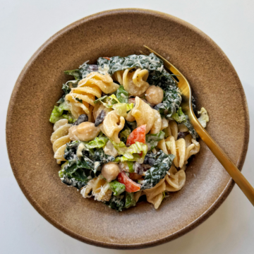 Bean pasta salad in brown bowl.
