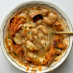 butter bean soup in white bowl.