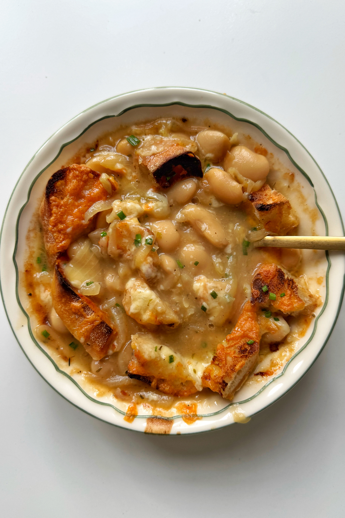 butter bean soup in white bowl.