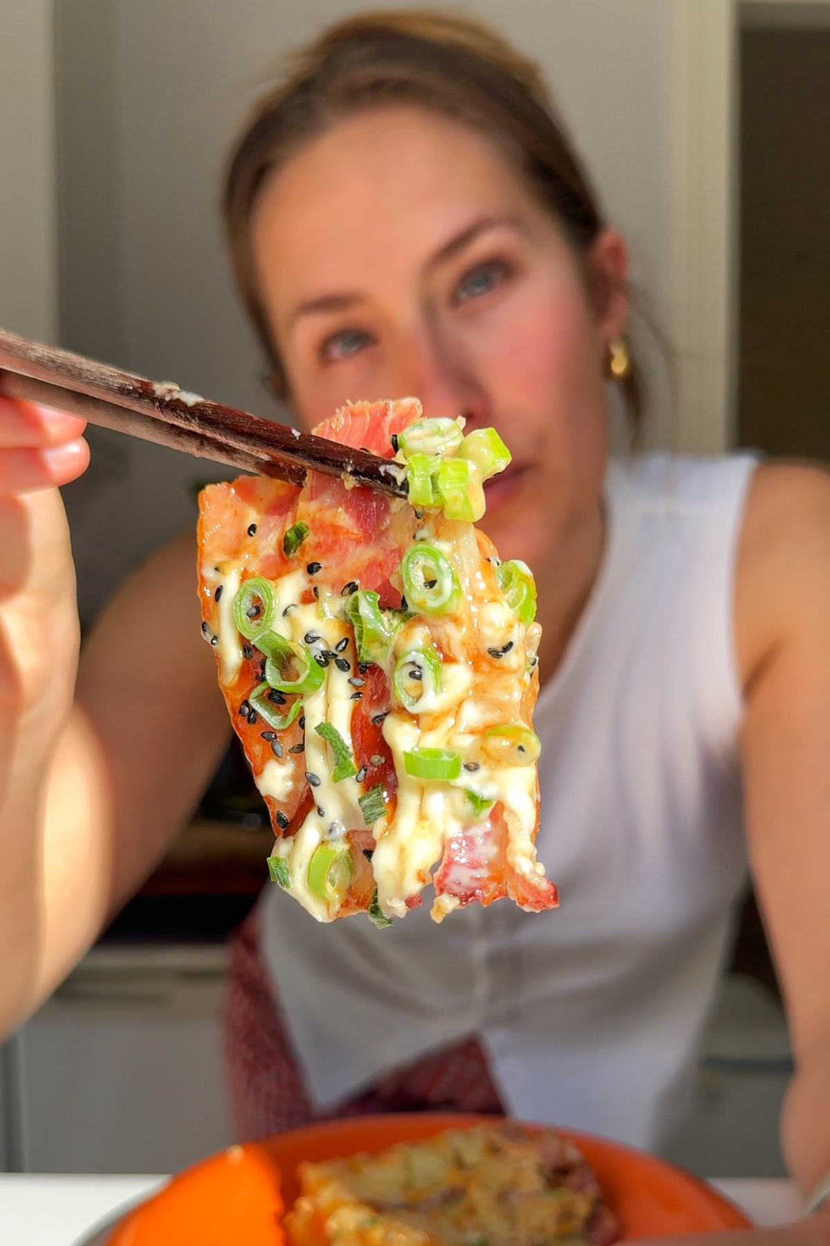 Bacon on top of okonomiyaki.