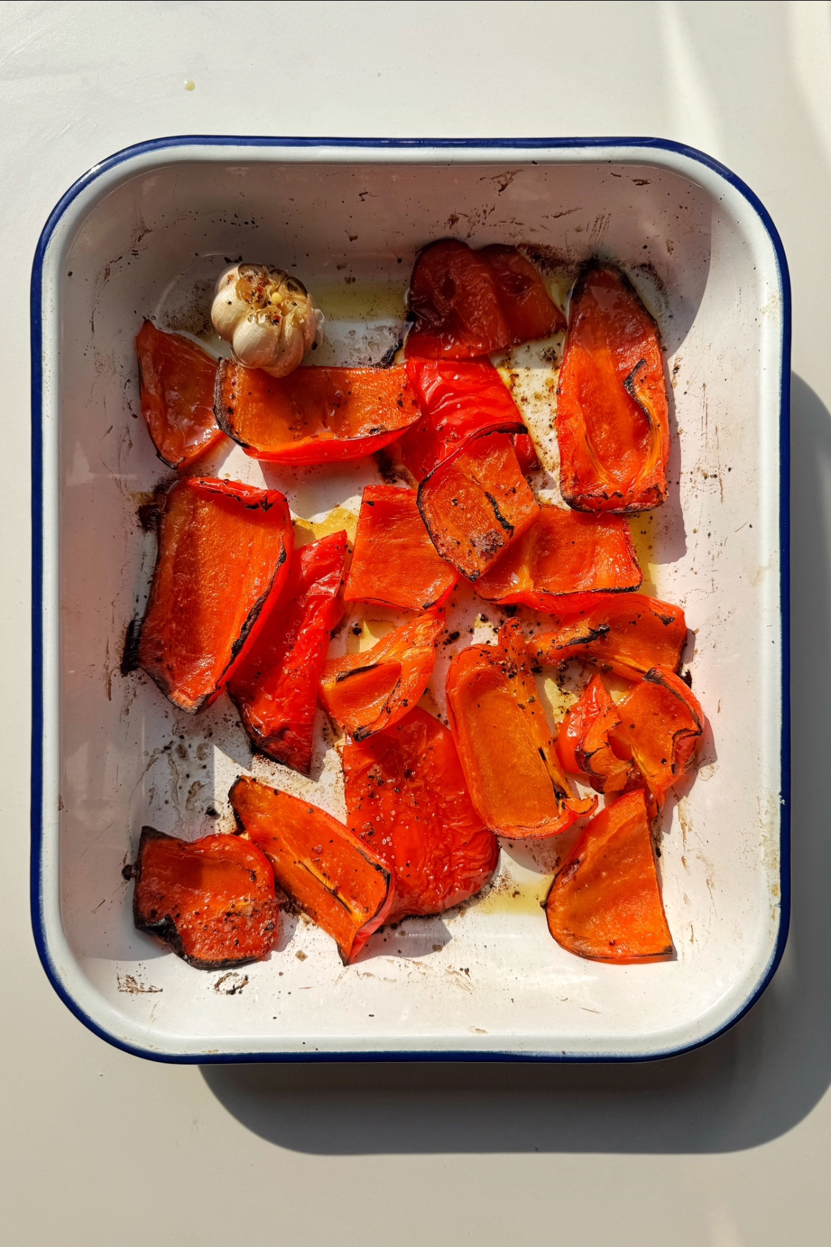 Roasting red bell peppers in the oven.