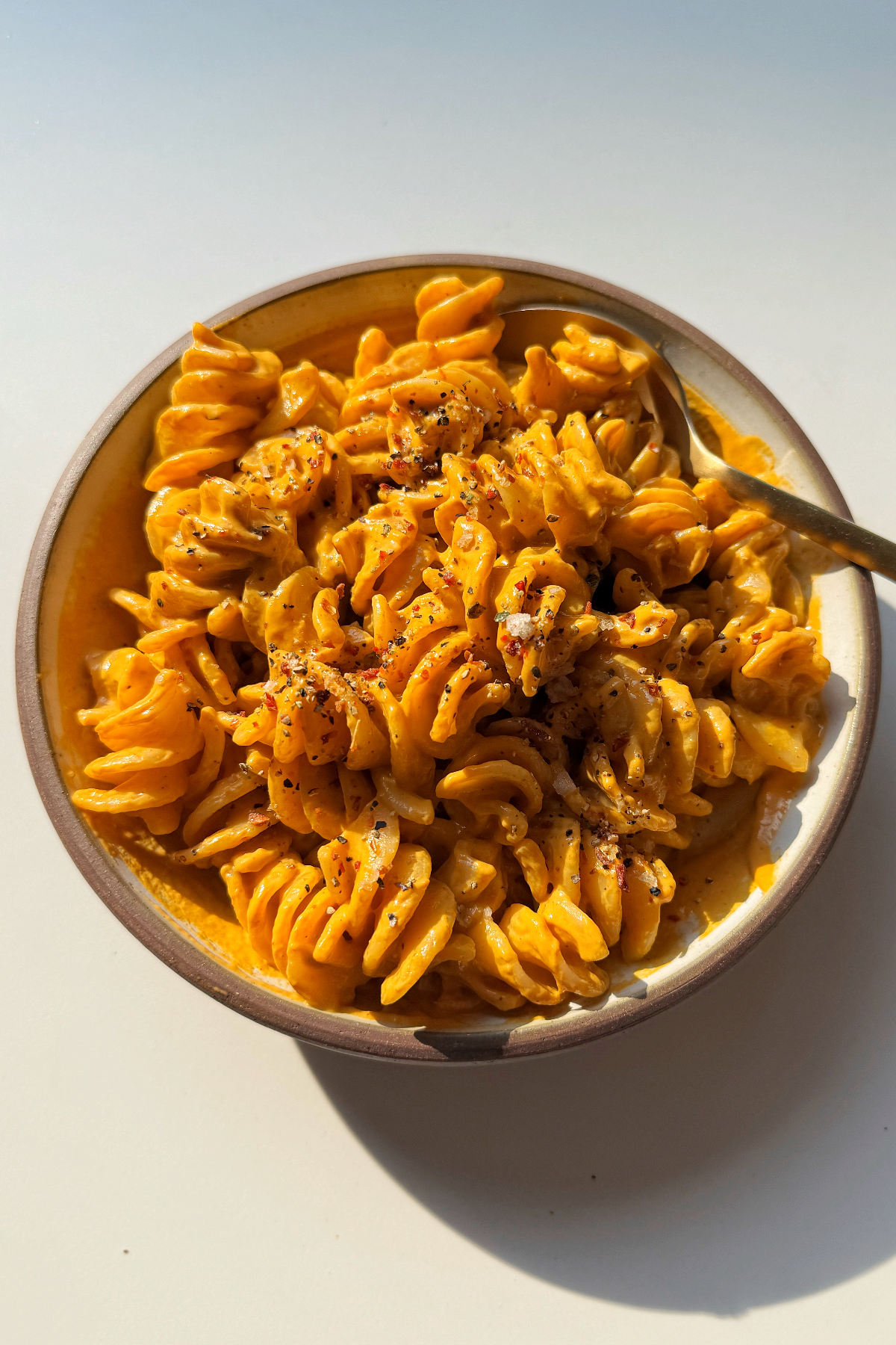 Red pepper pasta sauce in pasta.