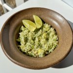 Avocado rice in brown bowl.