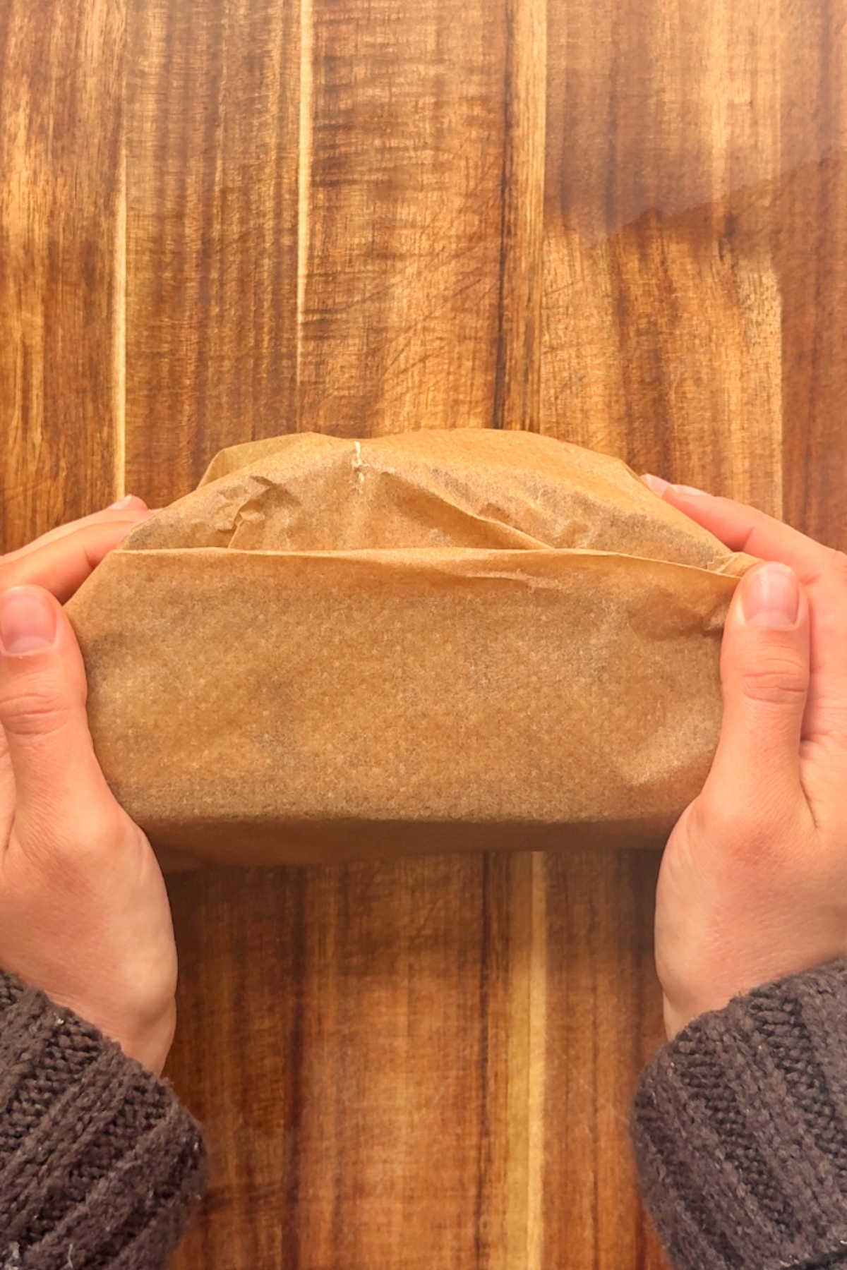 Wrapping the lamb sandwich in baking paper.