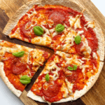 pizza wrap on wooden chopping board.