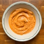 harissa aioli in a white bowl.