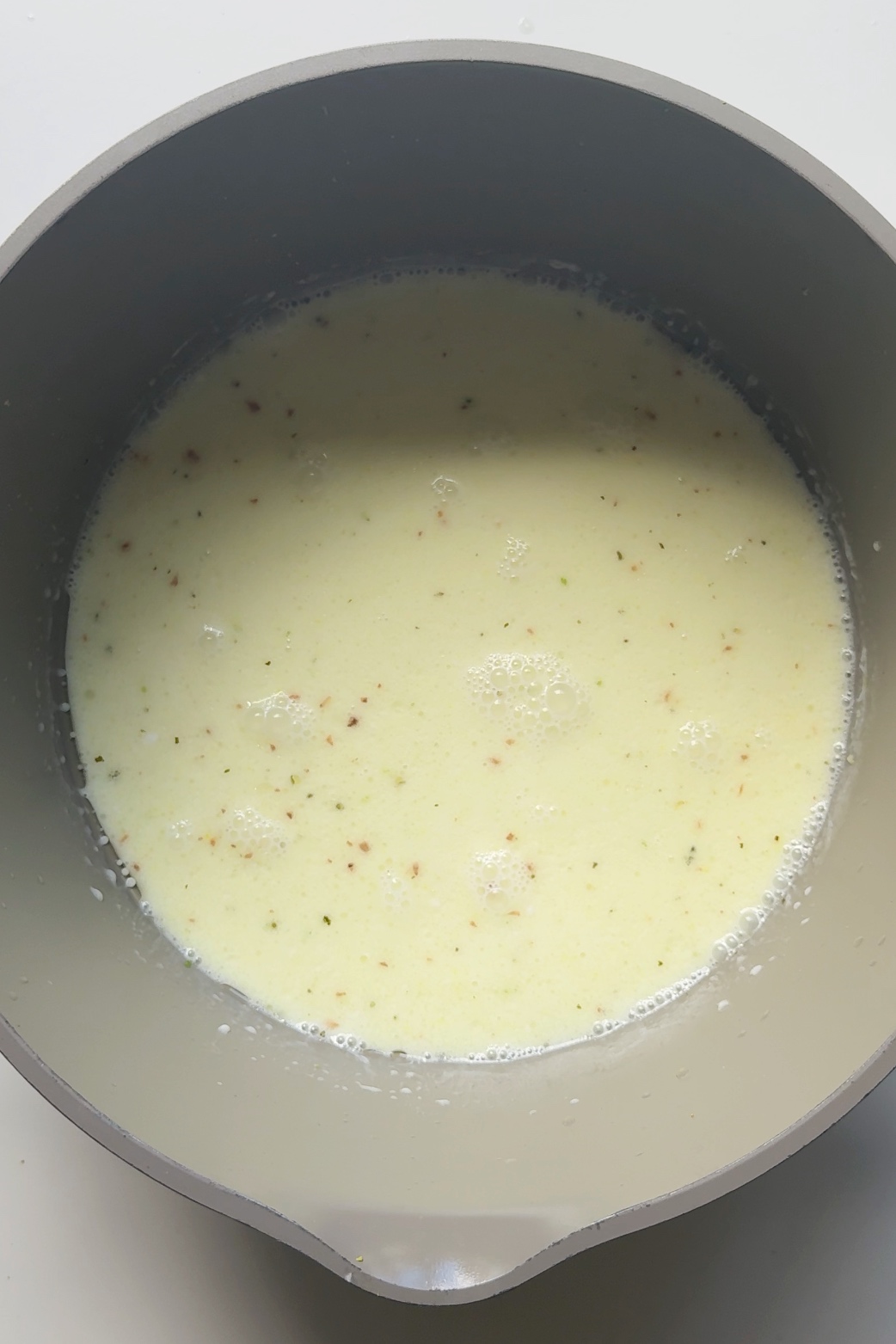 Lime and coconut sauce in pan.