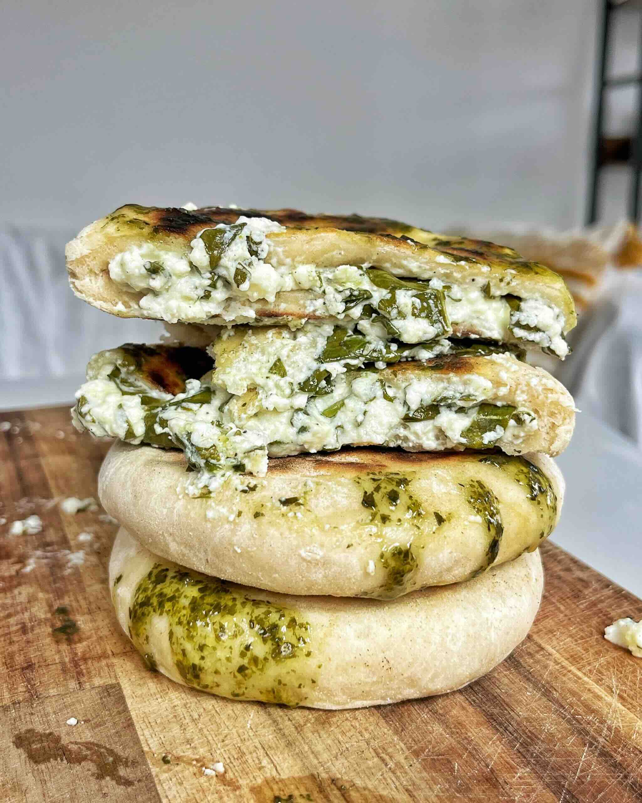 Spring feta flatbreads made with yogurt stacked on top of each other