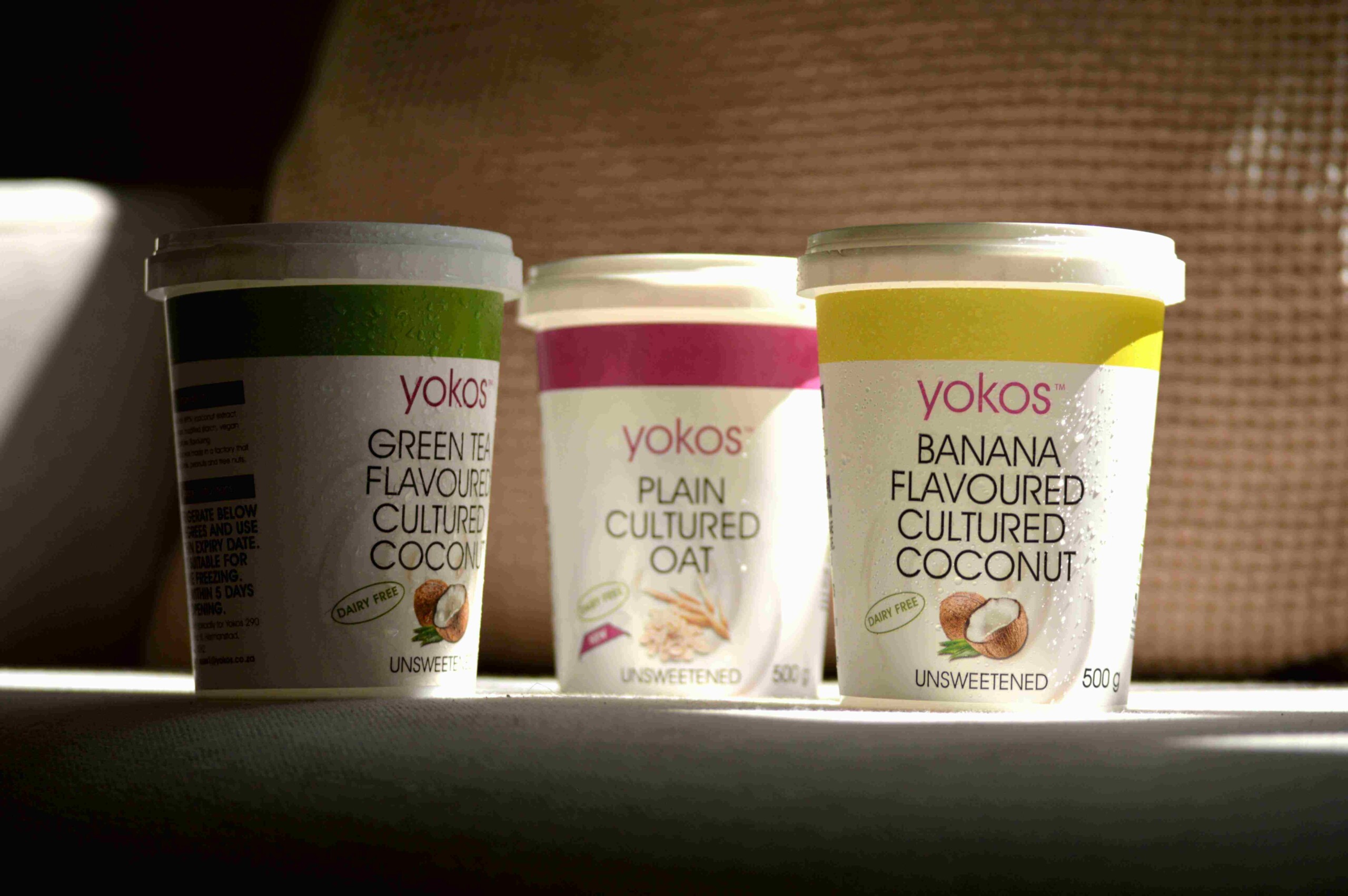 The tubs of yogurt, one of which is coconut yogurt as a greek yogurt alternative.