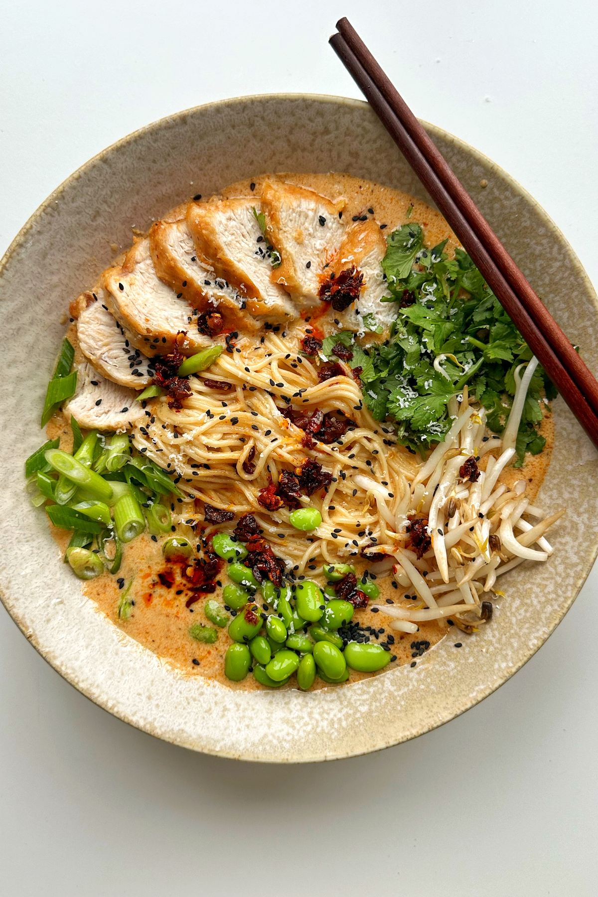 marry me chicken ramen in a bowl with chopsticks.