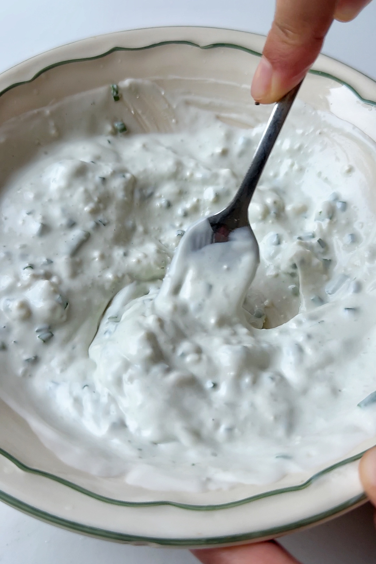 Making blue cheese sauce.