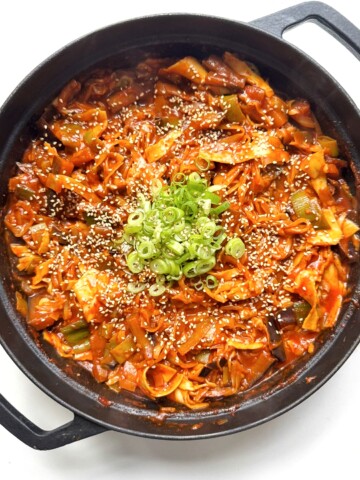 black pan with spicy gochujang lasagne in it.