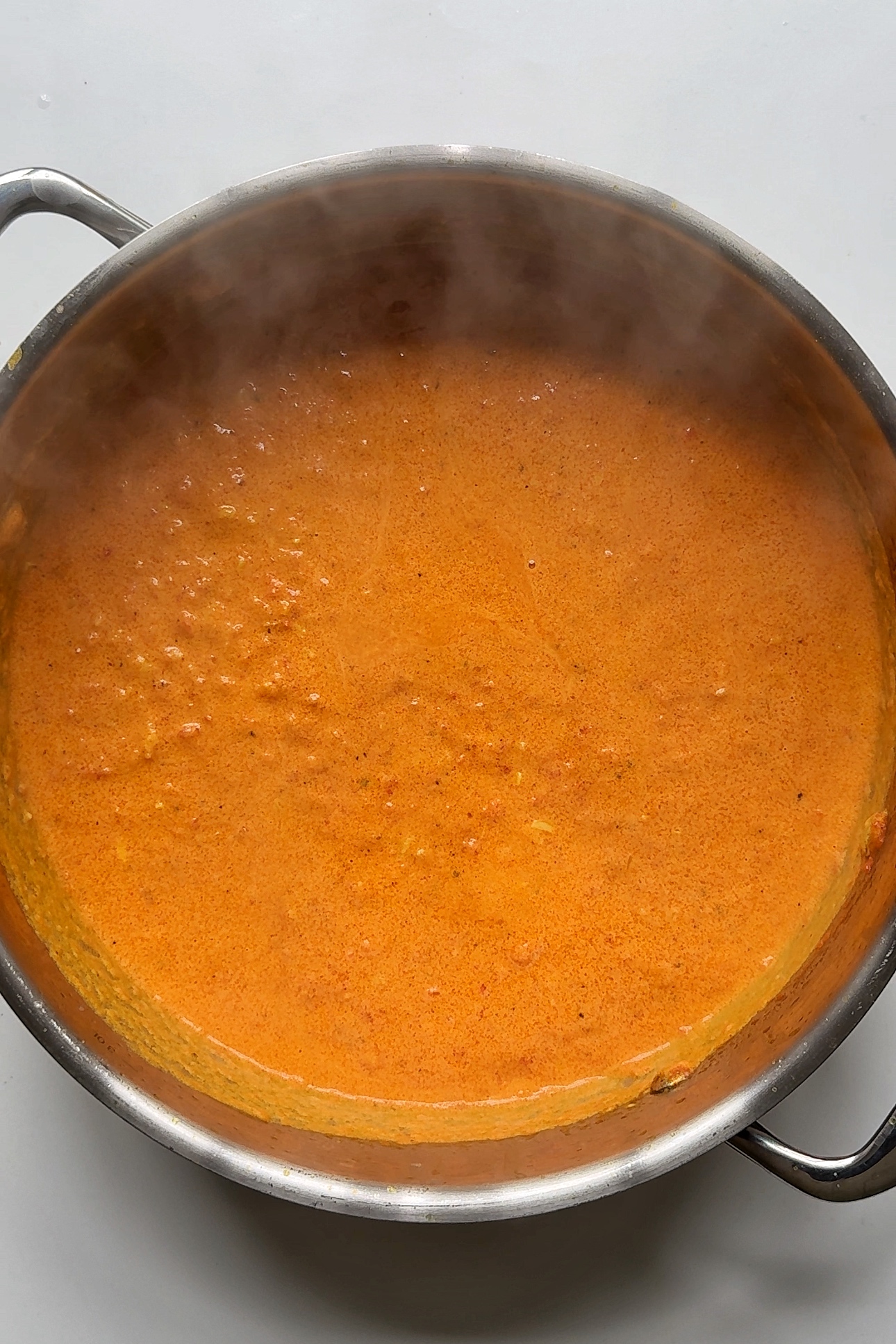 Cooking egg curry sauce.