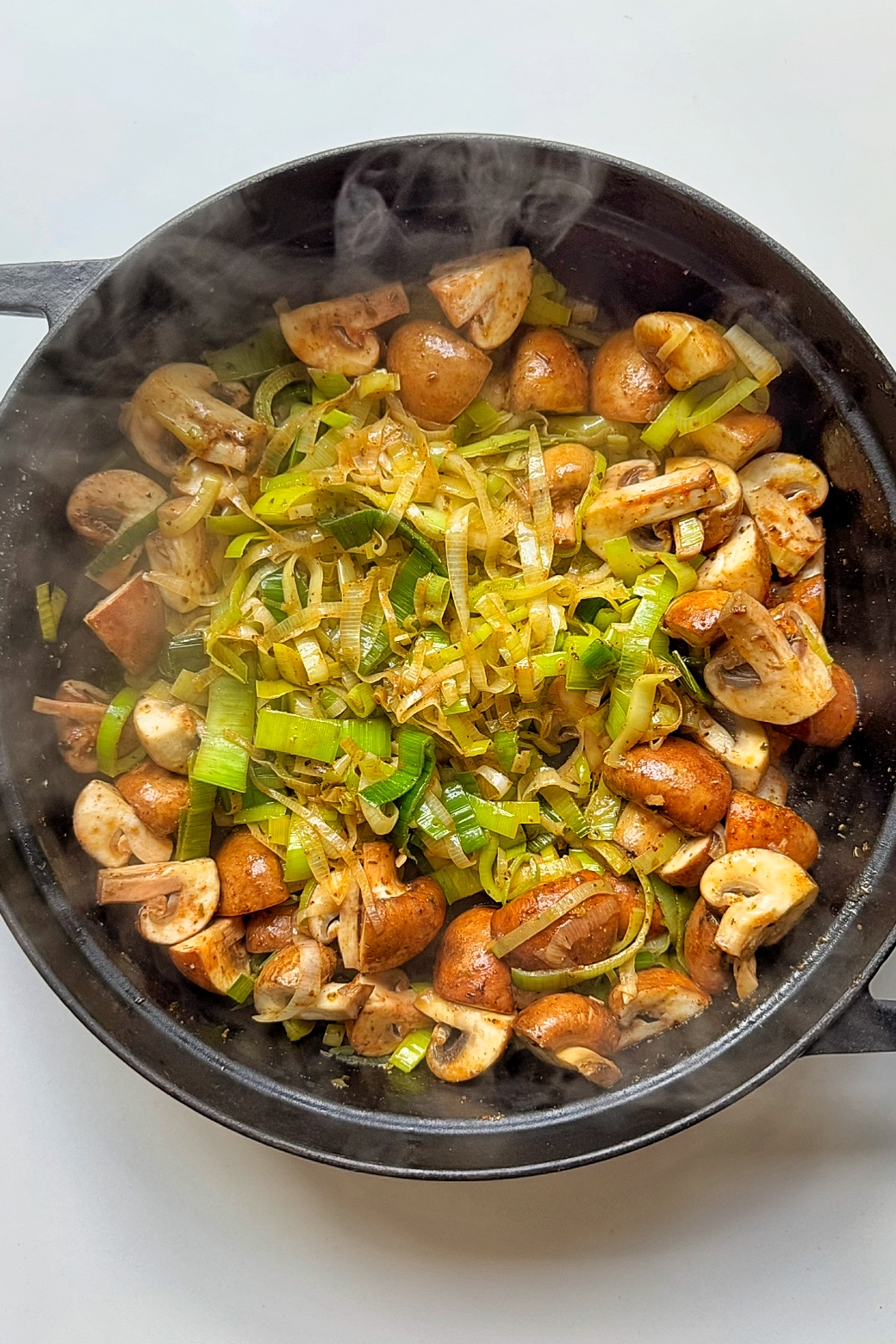 Making the filling for mushroom pie.