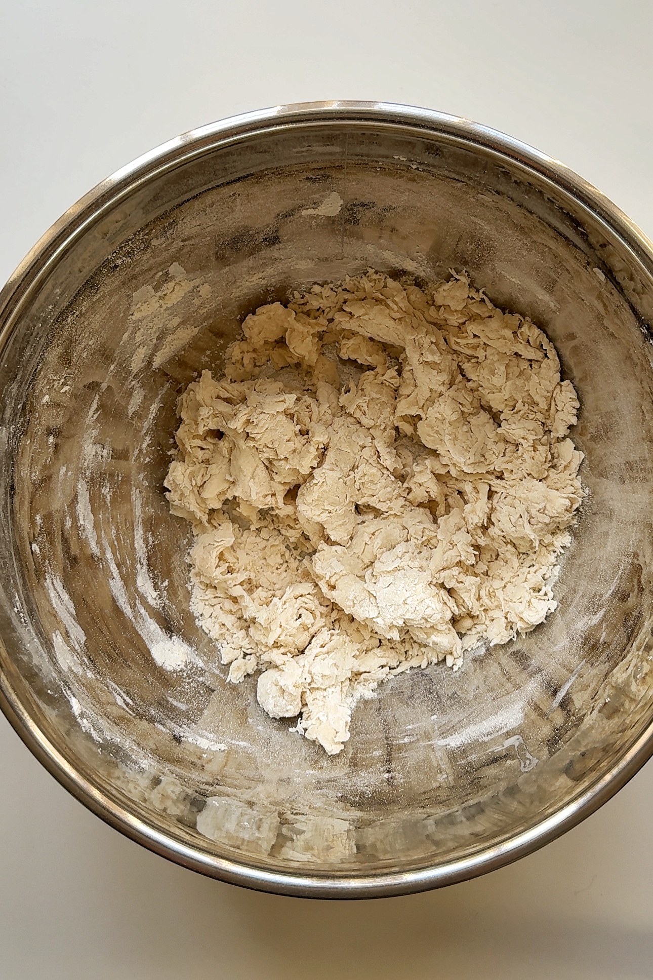 shaggy dough in metal bowl.