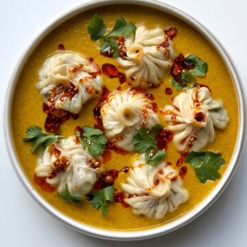 homemade Jhol momo in a white bowl.