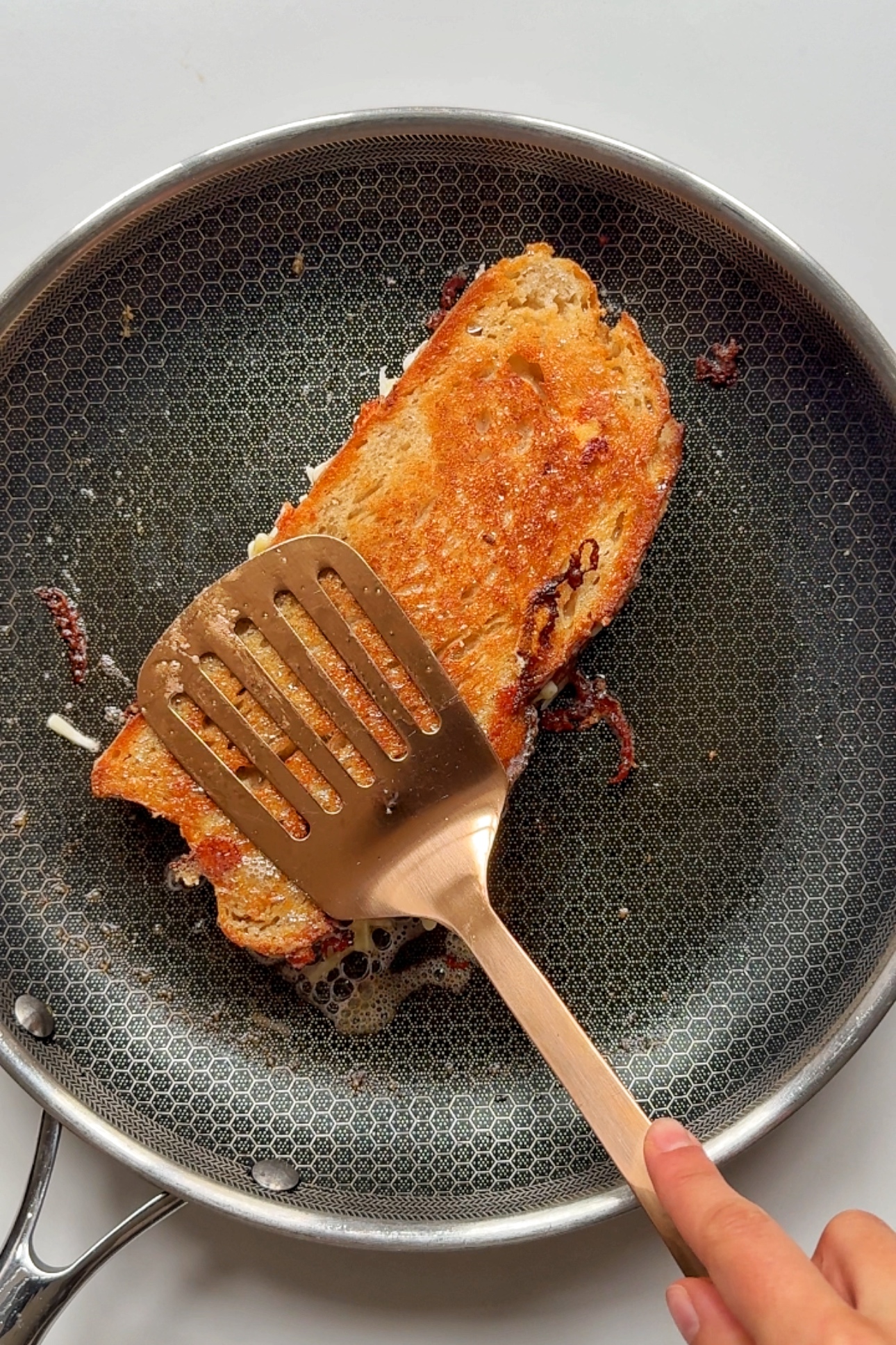 Frying cheese melt in pan.