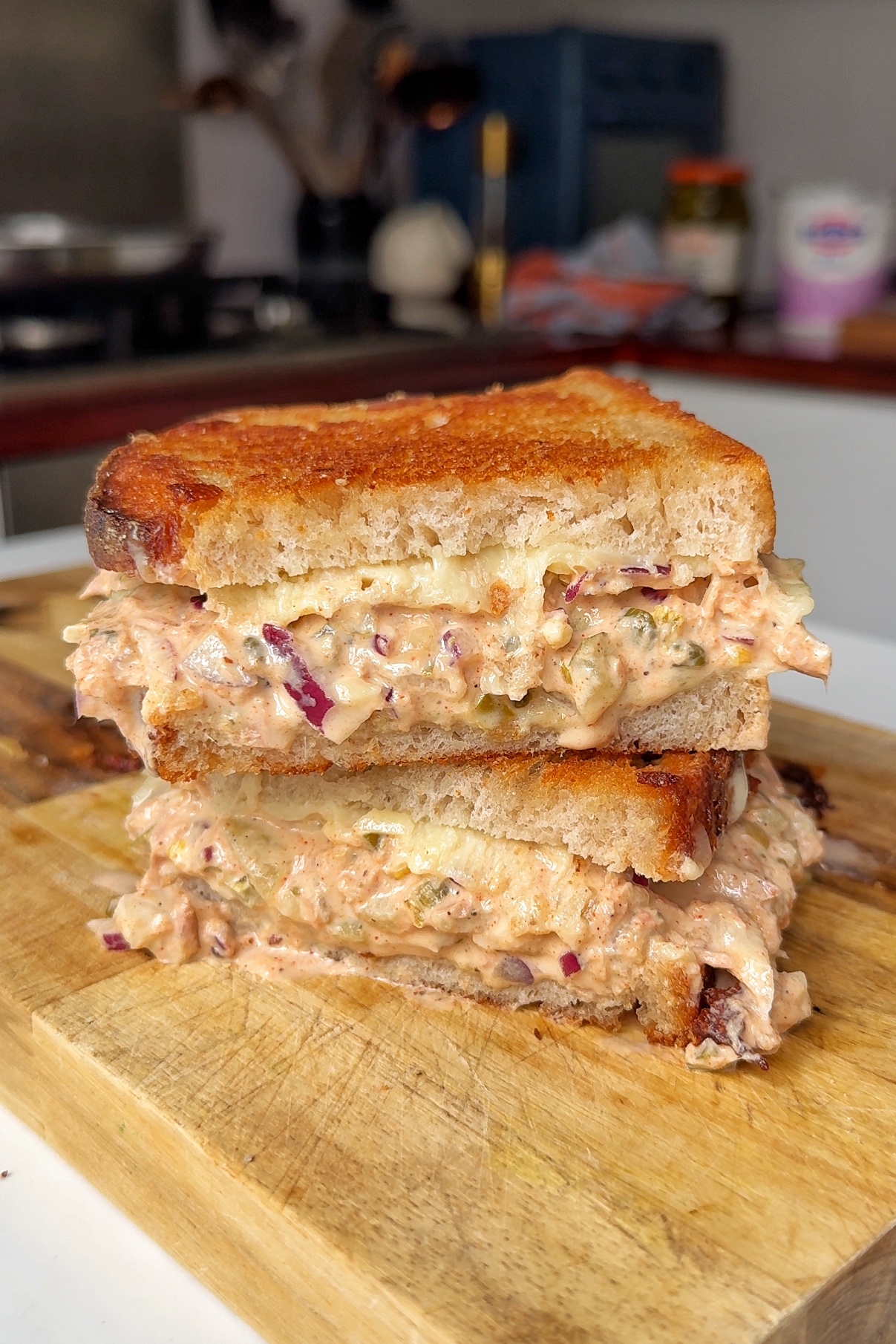 tuna melt on wooden chopping board