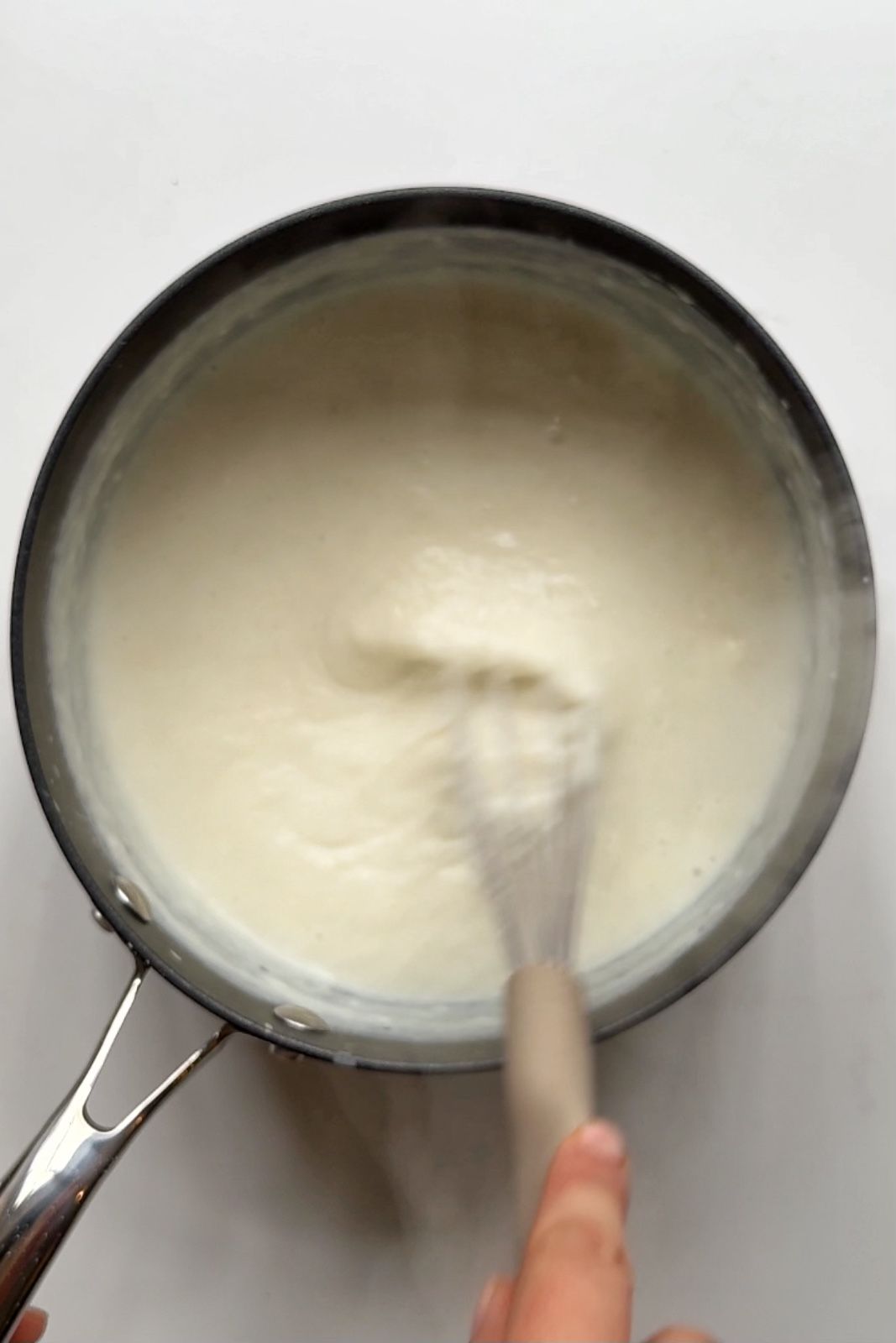 Making bechamel sauce.
