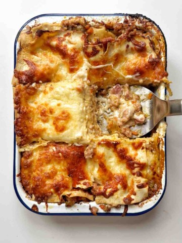 Christmas lagagna with a slice missing.