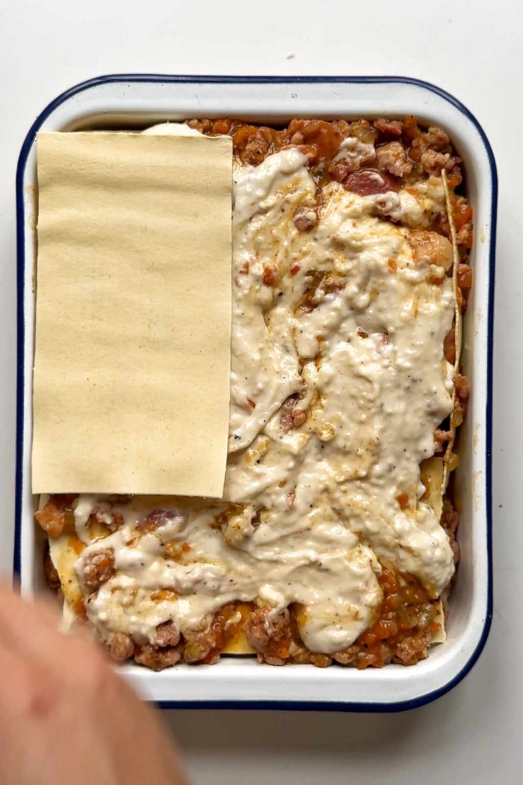 Assembling Christmas lasagna.