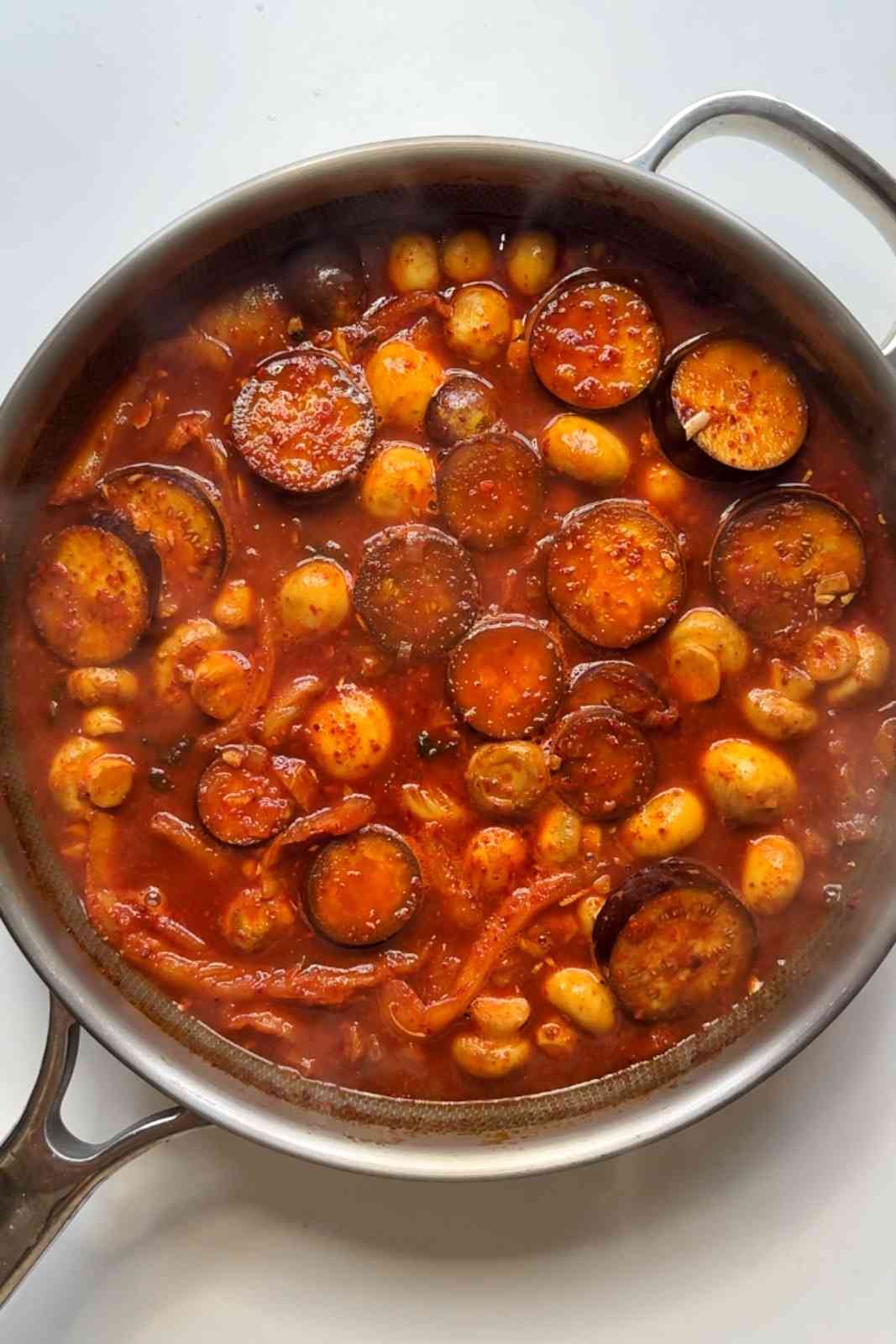 Adding sauce to the korean style chicken stew.
