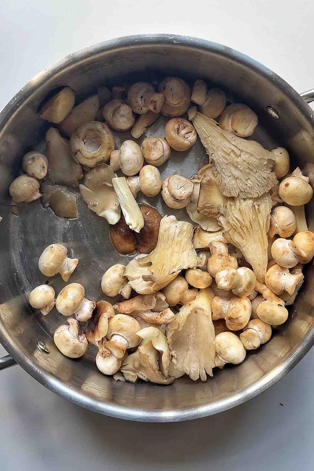 Frying mushrooms in a pan.
