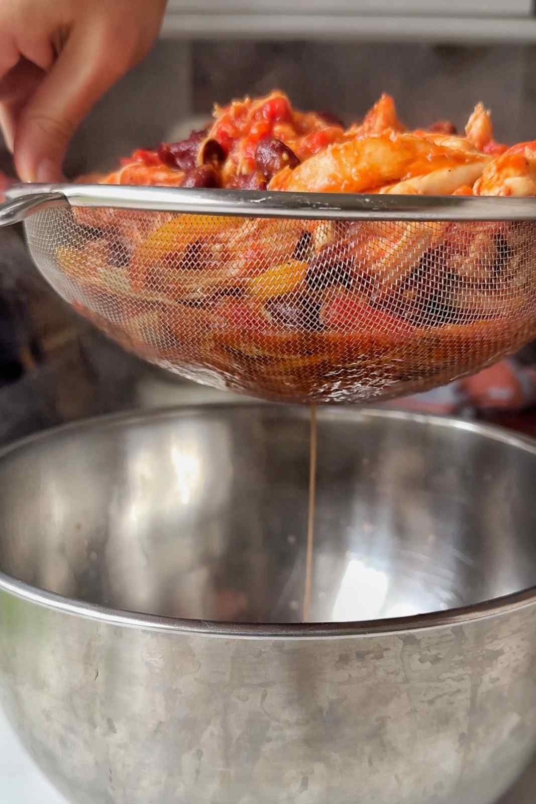 Draining the chicken.