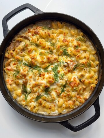 smoked salmon pasta bake in black pan.