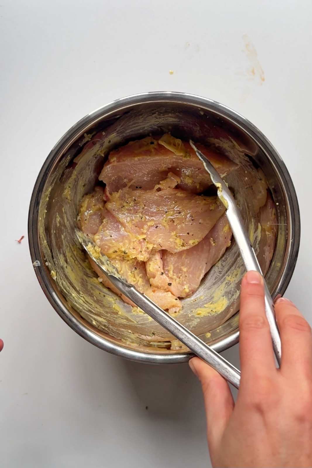 marinating chicken breast in dijon mustard.