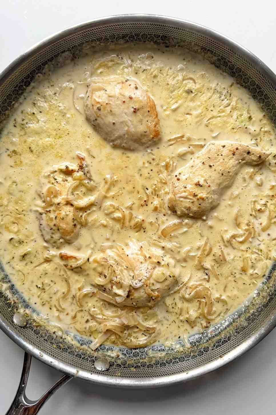 dijon mustard chicken in a frying pan.