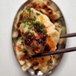 Pork and shrimp dumplings with chilli oil.