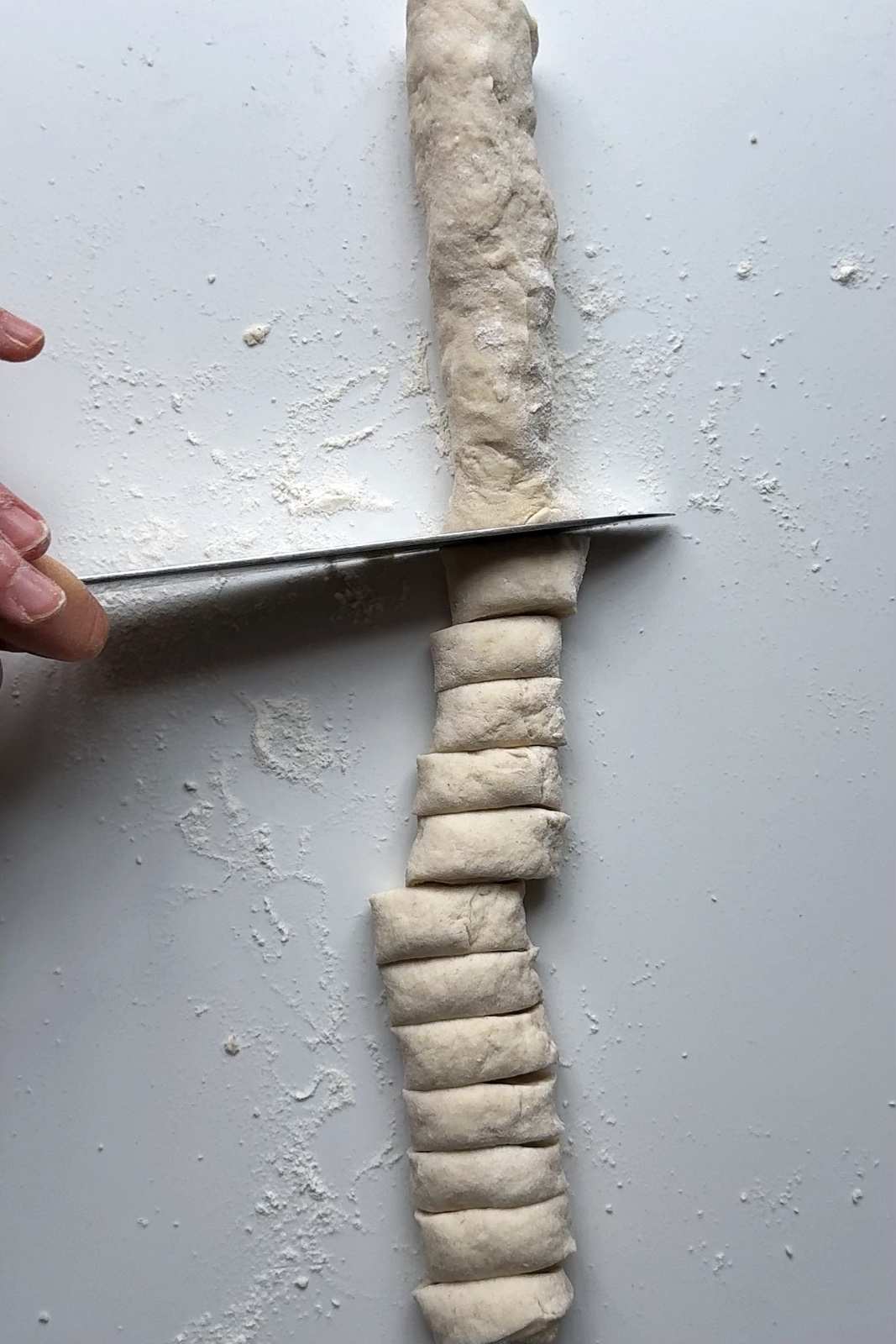 Making the dumpling wrappers.