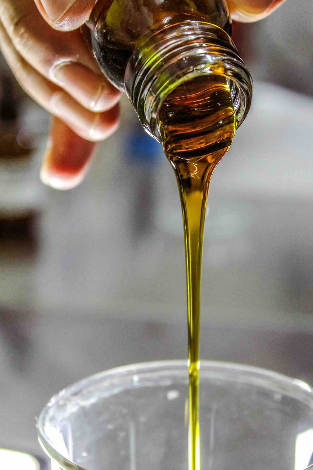 Olive oil being poured into a bowl